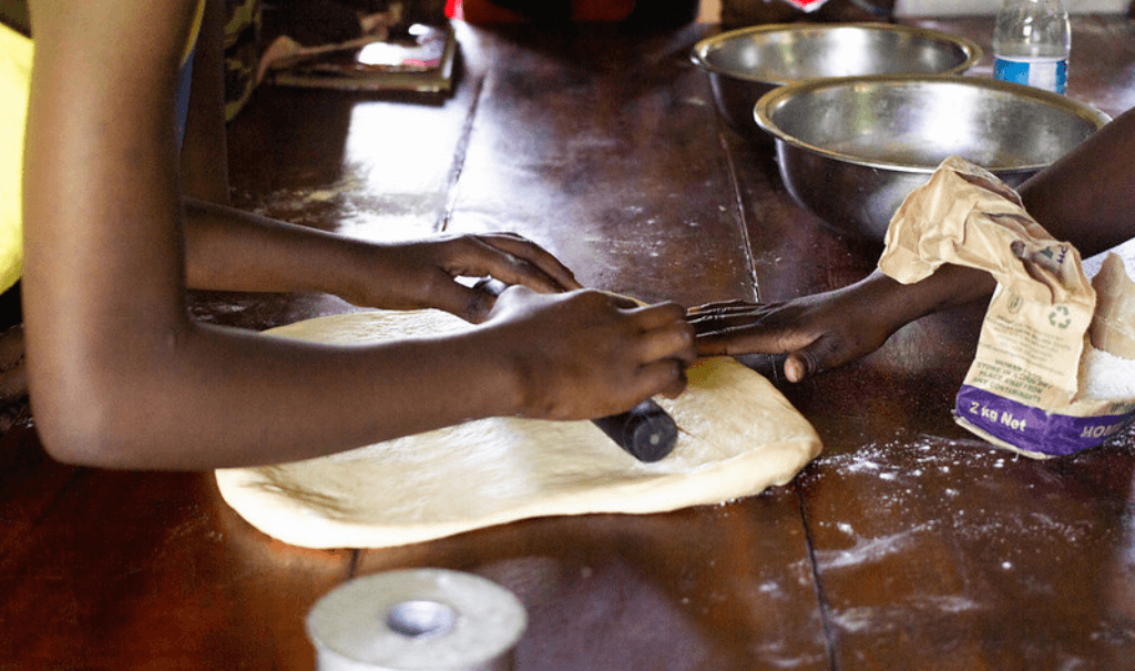 girls rolling out dough