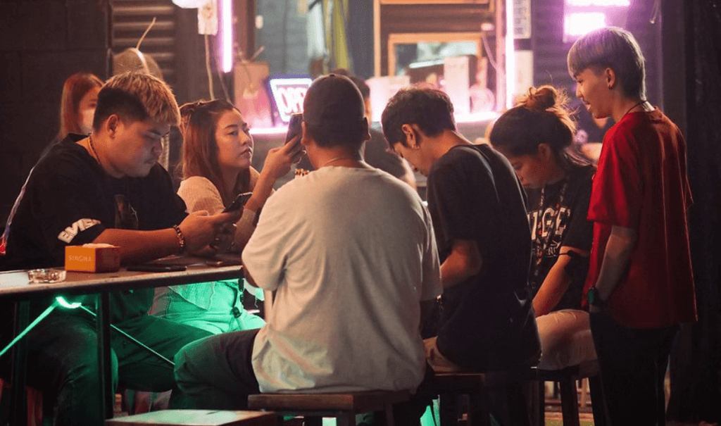 thai youths using phones