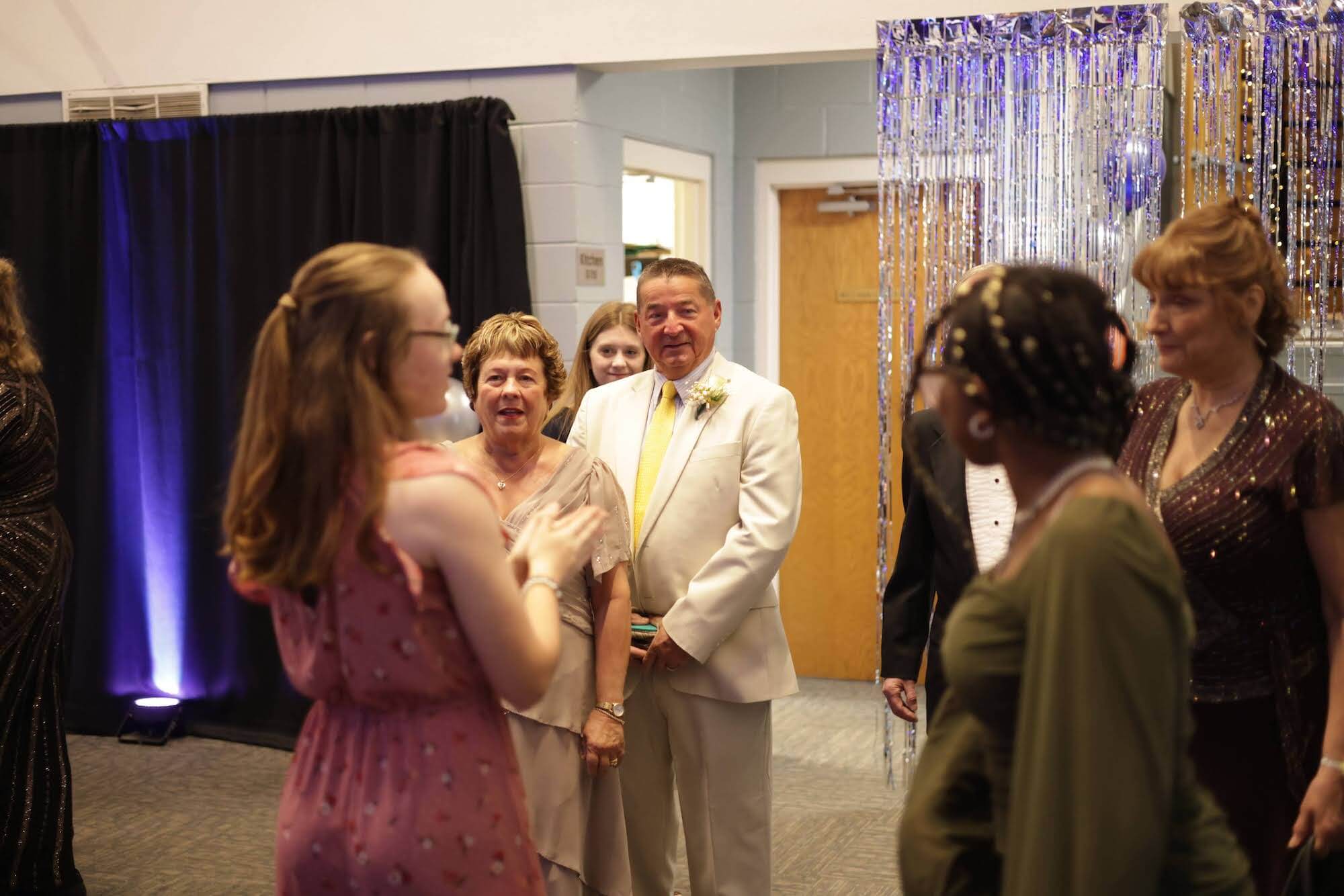 A student welcomes guests