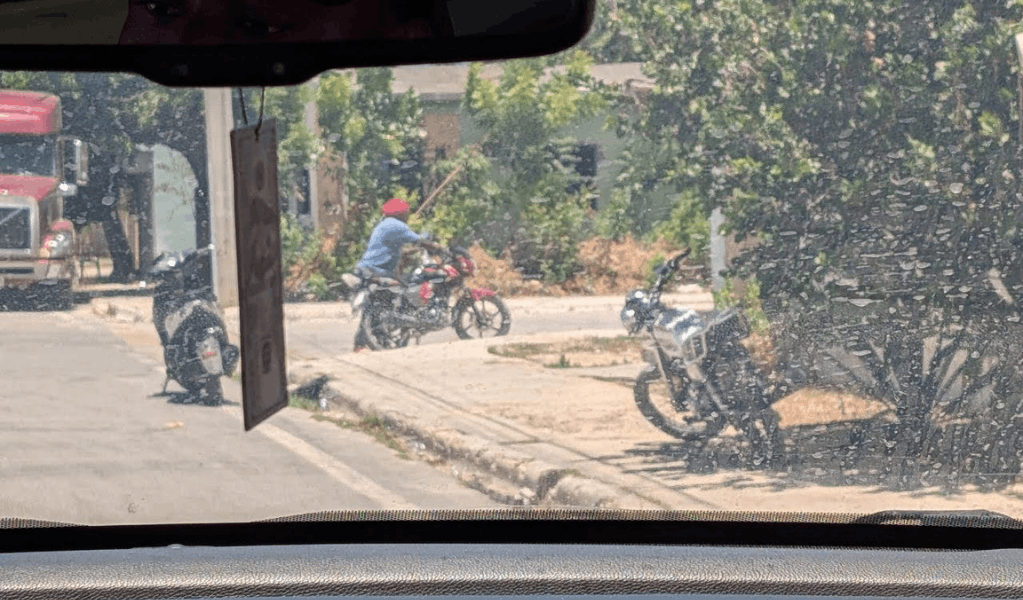 An agent conducts surveillance outside the residence 