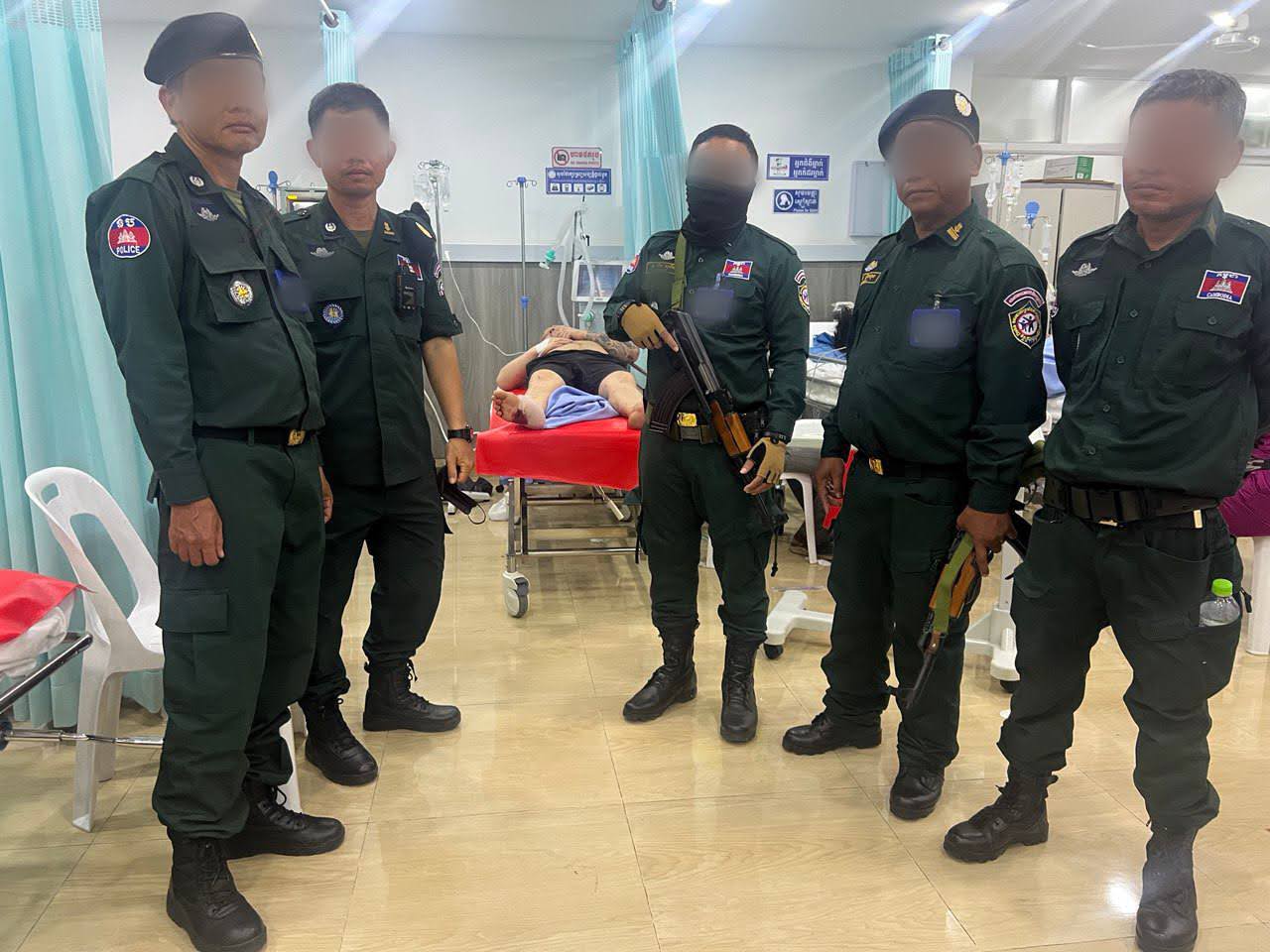 Police stand guard at the hospital with a trafficker who attempted to escape via a window