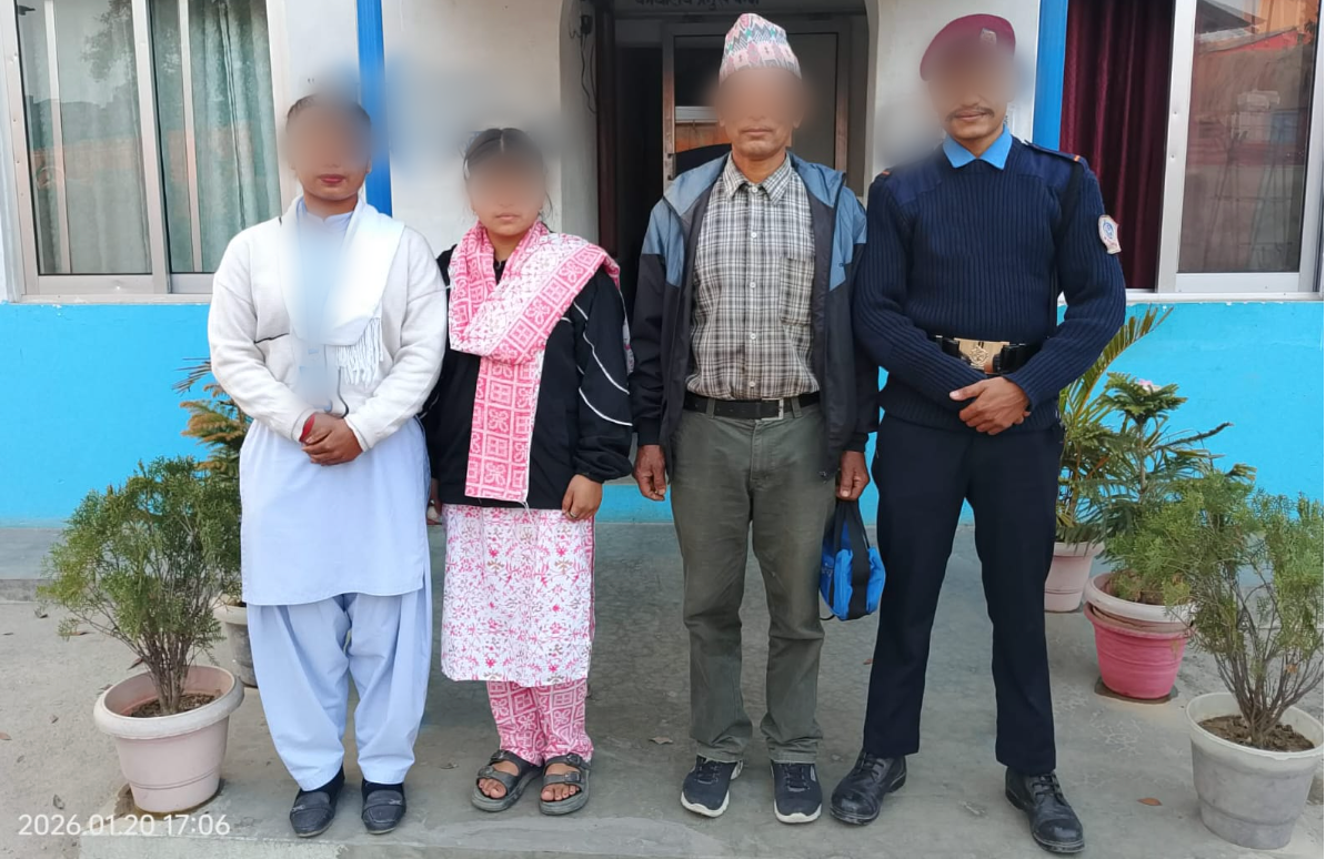 Eniya stands beside a border agent, her uncle and a police officer