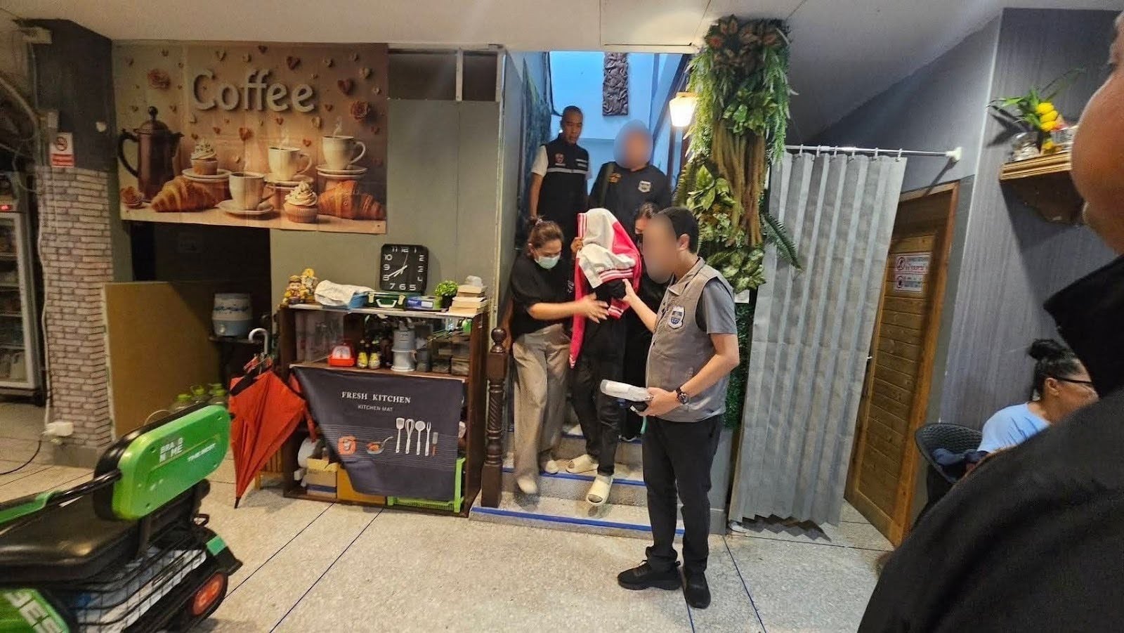 Talay being escorted to safety by caseworkers