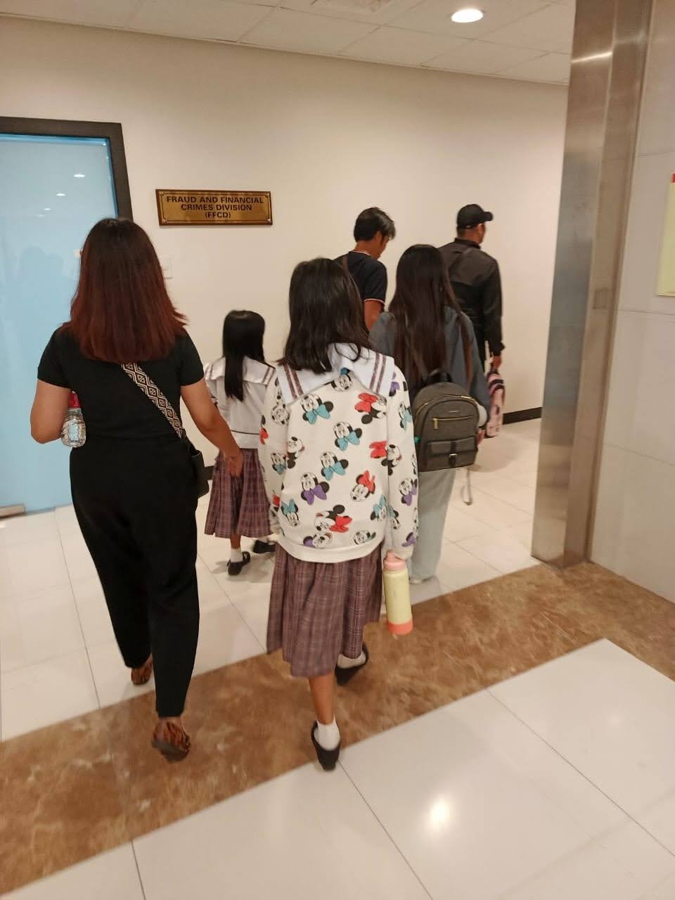 Destiny Rescue’s social worker walks beside the children as they enter government care