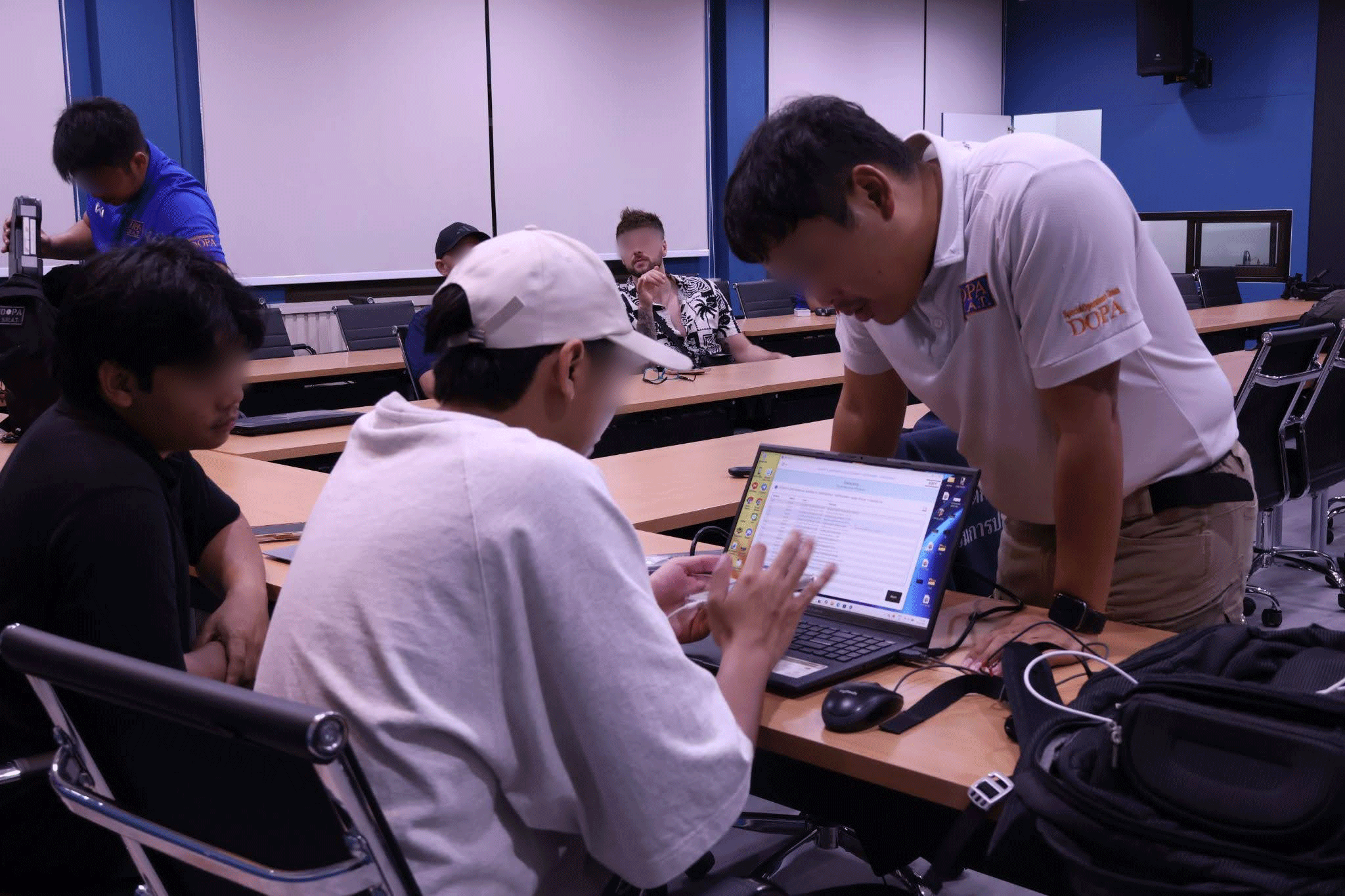 Our counter-OSEC team in Thailand extracts digital forensics from a survivor's phone